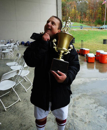 Holding the Conference Championship trophy
